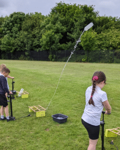 children launching rockets for the neil armstrong workshop