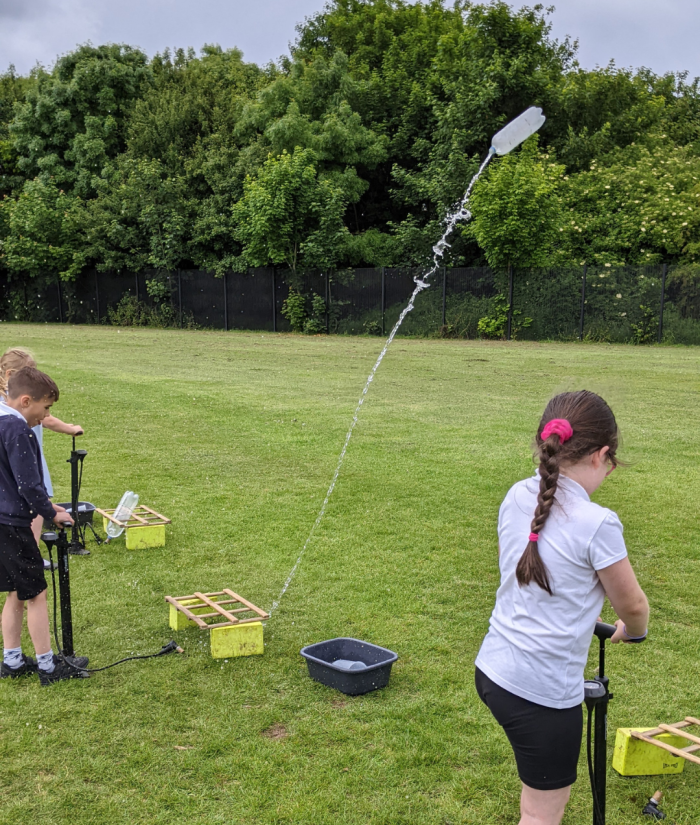 children launching rockets for the neil armstrong workshop