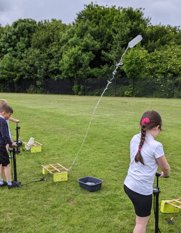 children launching rockets for the neil armstrong workshop