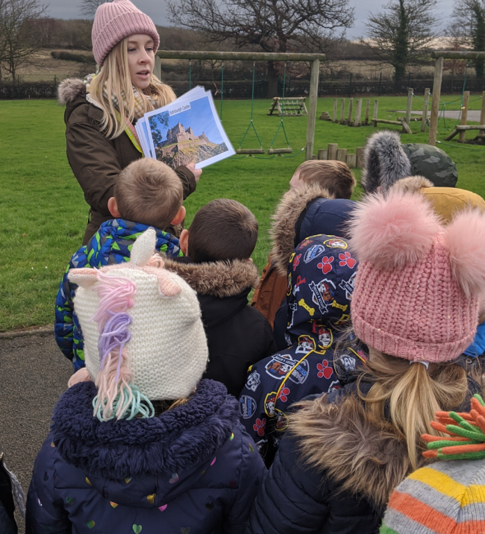 Children listening to the castles outdoor workshop