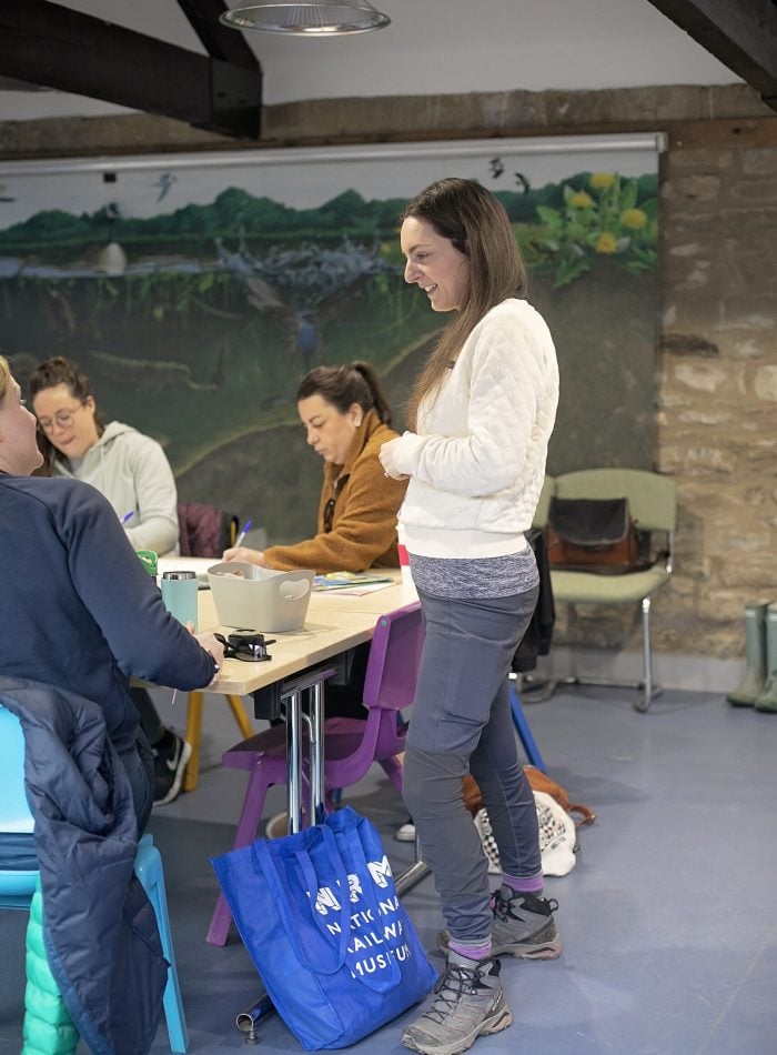 a woman talking to a teacher about curriculum outdoor learning