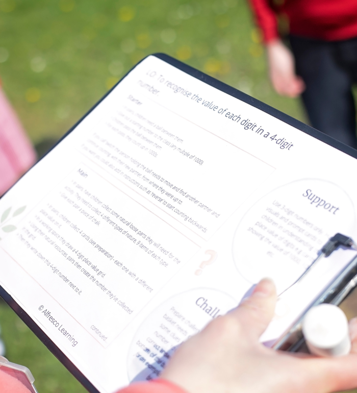 Curriculum linked outdoor lesson plan on a clipboard