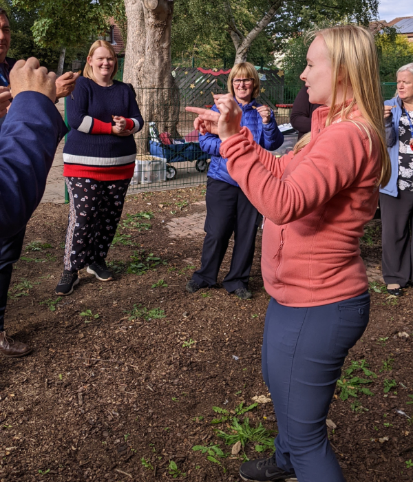An Alfresco Learning staff member training teachers in taking the curriculum outdoors