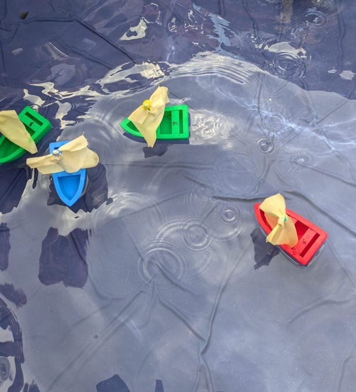 Model sail boats floating on water